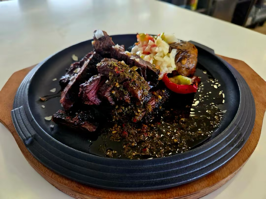 Prime Ribeye steak served with traditional Canarian potatoes and mojo at Callao Salvaje